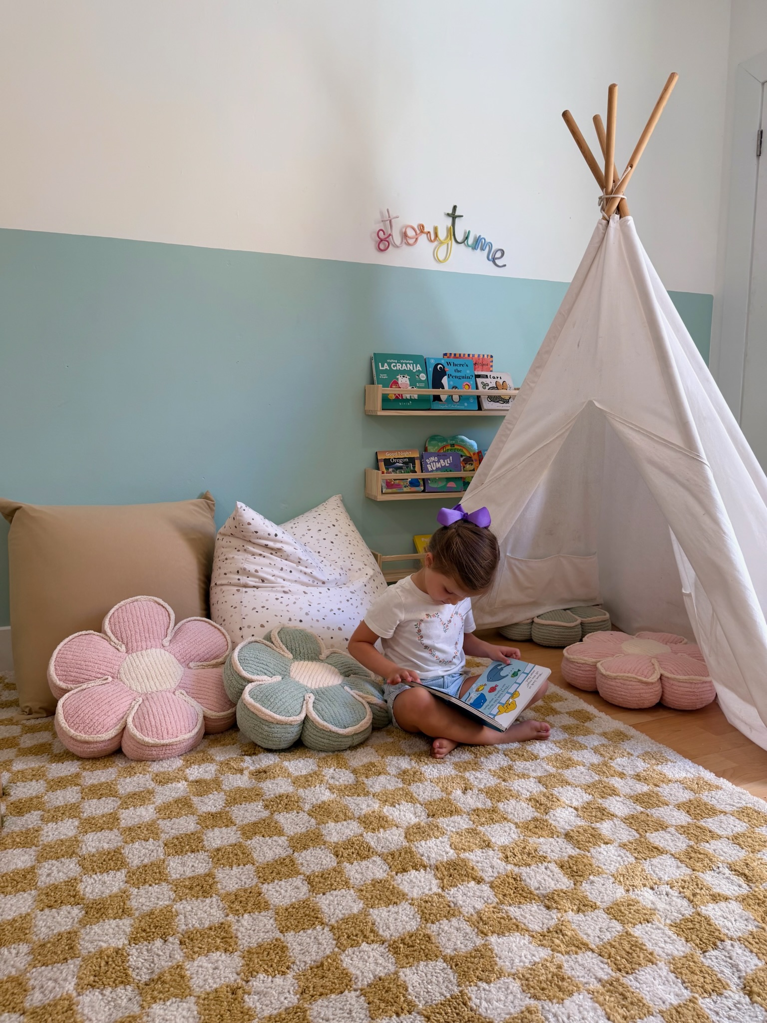 Child reading in the storytime corner at Happy Nook Early Education Center