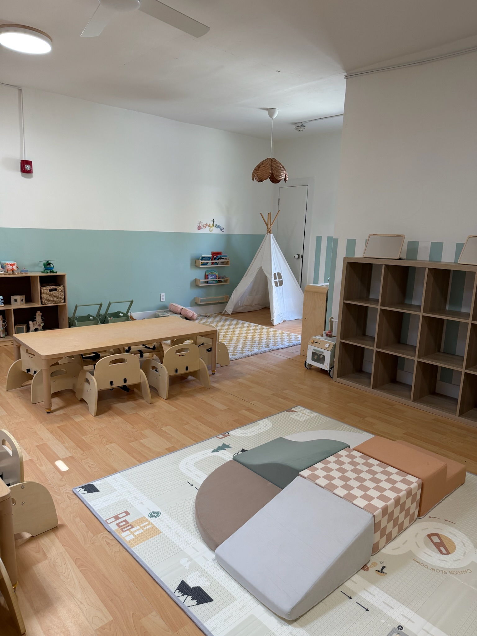 Happy Nook toddler and preschool classroom with teepee and activity table